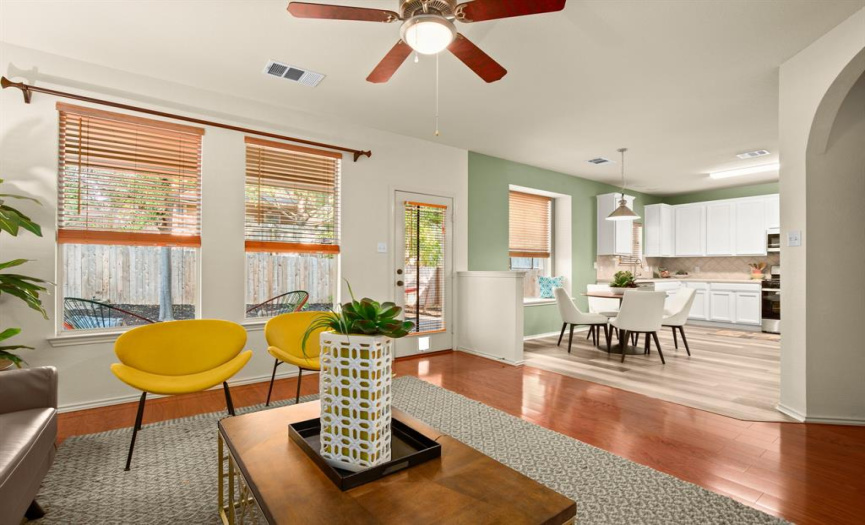 A sweeping archway leads you to the bright and spacious eat-in kitchen, seamlessly connected to the family room, making entertaining a breeze.