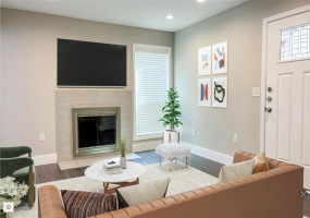 Two story condo has a fireplace !! Open to kitchen area (virtually staged by designer)