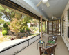 The patio was extended beyond the screened portion of the porch and features a generous electric awning.