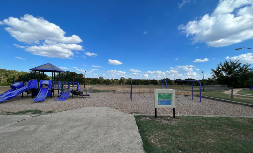 Lot backs up to park with playscape and picnic area