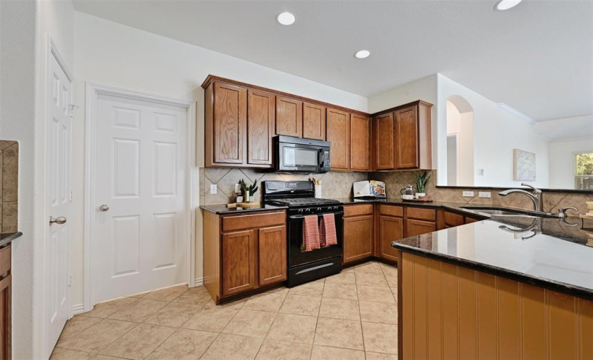 Kitchen with pantry and access to laundry room