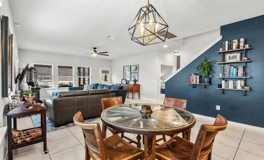 The dining area is bathed in natural light, creating the perfect backdrop for family meals.