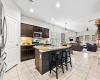 Beyond the entry is the heart of the home - the centrally-located kitchen.