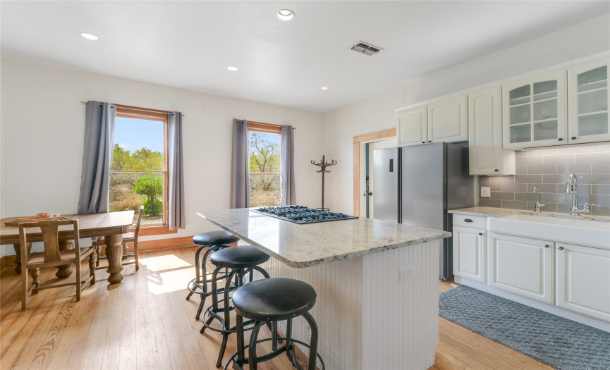 In addition to the formal dining room, there is a space for a breakfast room within the kitchen and a large center island