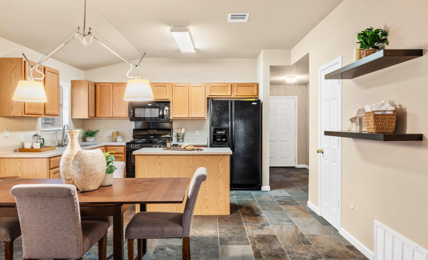 The kitchen connects to the dining space.