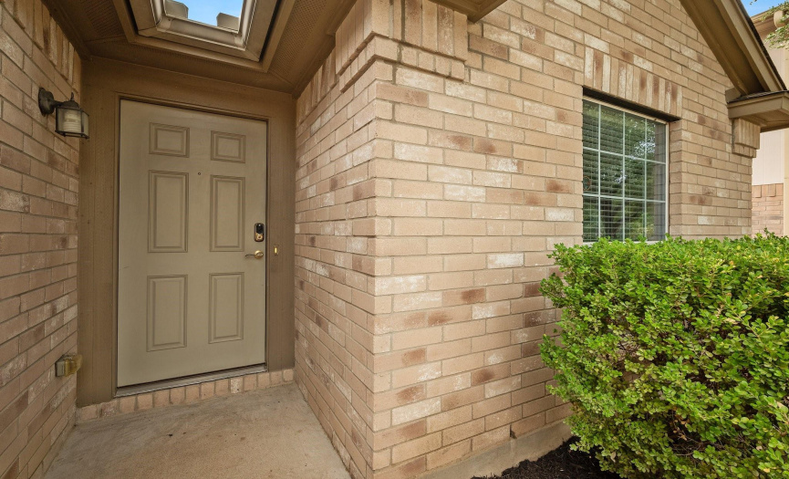The inviting home features a charming brick exterior.