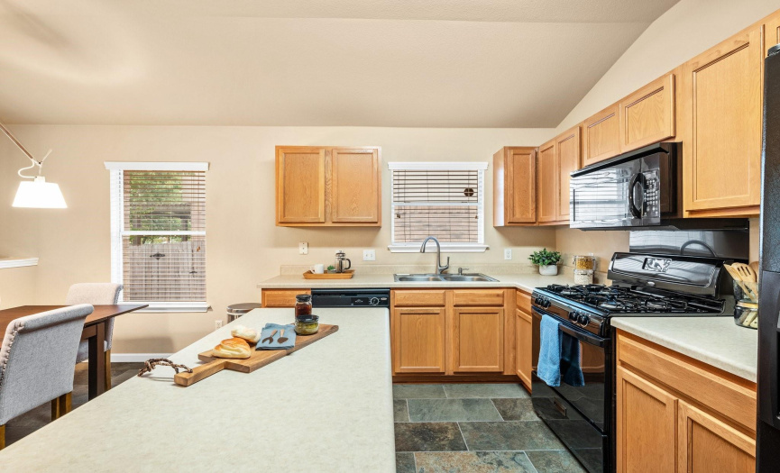 The well-appointed kitchen features ample cabinet space.