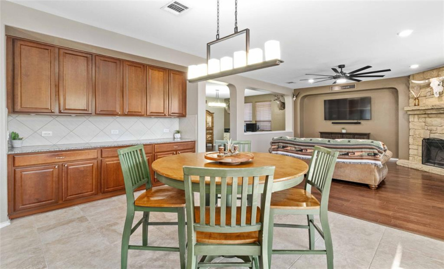 The kitchen also provides an expansive built-in buffet countertop with plentiful additional cabinetry storage for all your formal dining ware and kitchen accessories.