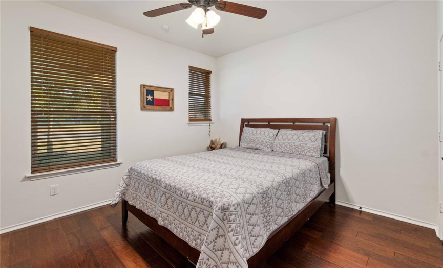 The other secondary bedroom overlooks the front yard. Both secondary bedrooms offer great closet storage and hardwood floors.