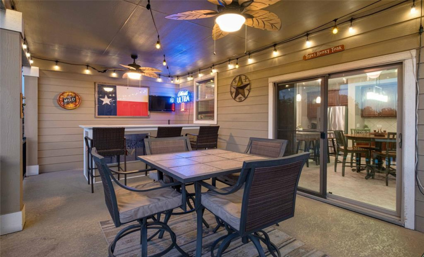 Take your outdoor entertainment to the next level with the amazing covered back porch and built-in bar!