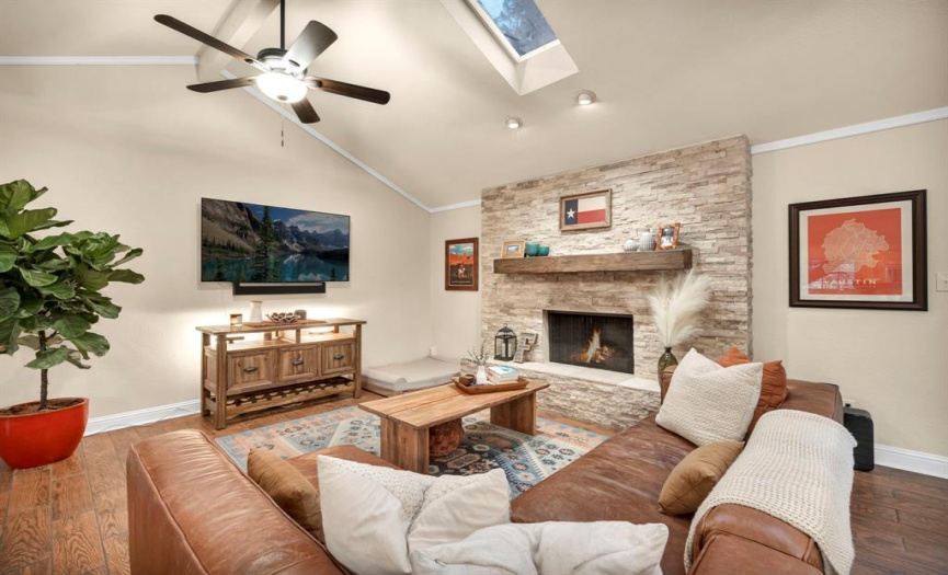 Fireplace and vaulted ceiling with 2 skylights in the living area