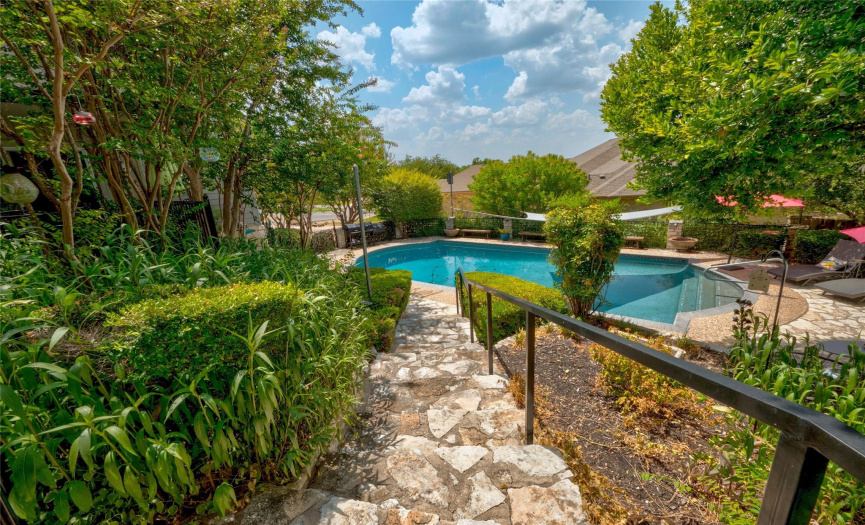 Beautifully landscaped private backyard with pool