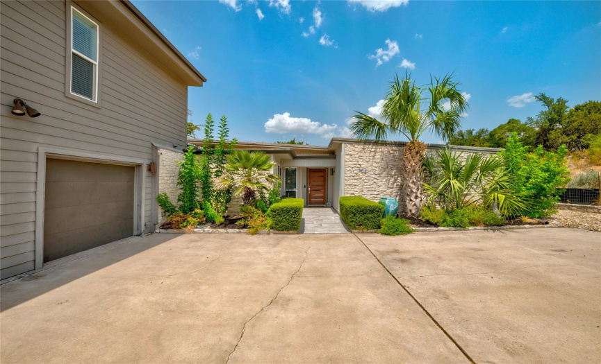Modern home on a quiet, private cul-de-sac with large, landscaped lot and lots of outdoor space.
