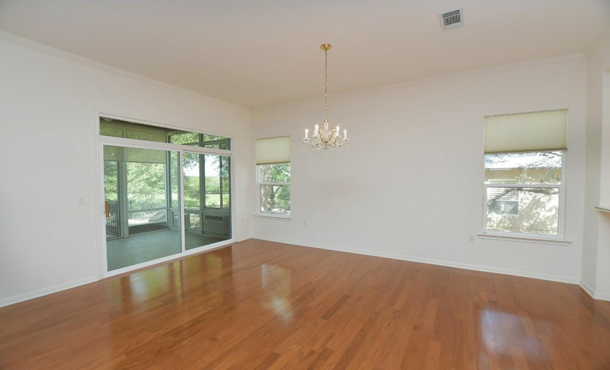A sliding door leads from dining room to the glassed patio with views beyond of the pool and golf course!