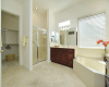 A separate shower, walk-in closet and water closet are part of this large primary bath.