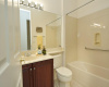 Mere steps from the guest bedroom, the guest bath is located in the main hallway.