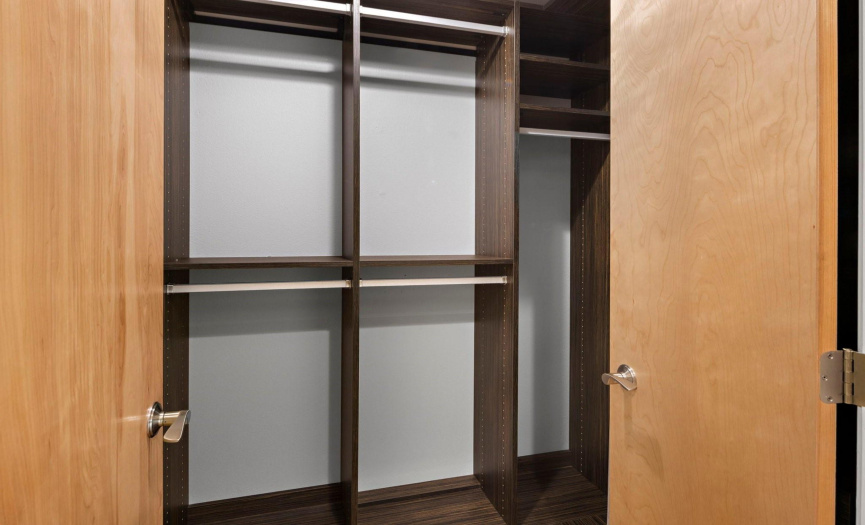 The walk-in closet with custom storage will easily accommodate all of your clothing and accessories