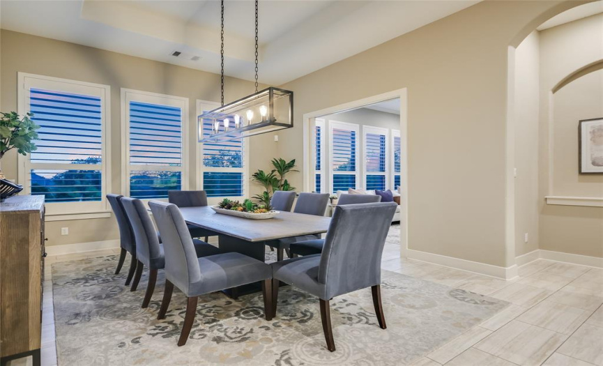 A casual dining space is located in the kitchen and next to the sunroom.