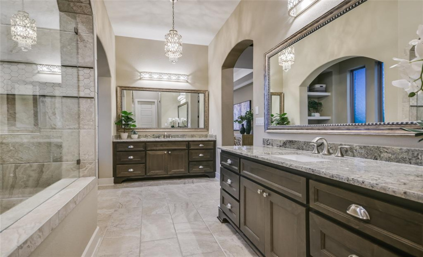 The primary bathroom was designed to pamper, with a soaking tub, dual vanities and large walk-in shower.