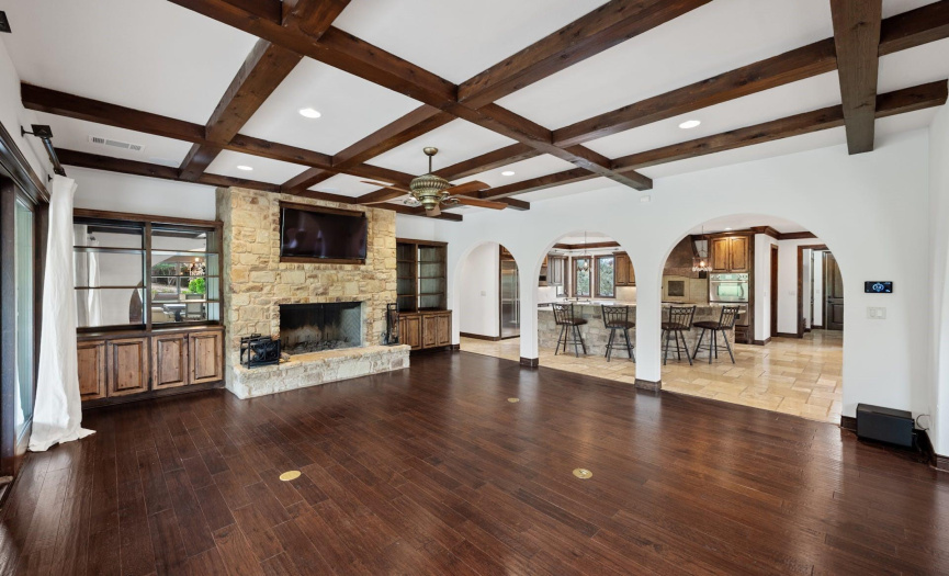 beautiful wood floors adorn the family room open to the kitchen