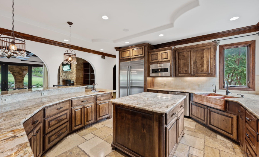 nicely appointed kitchen with space for family and friends