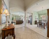 Grand foyer with tray ceiling, arched passageways