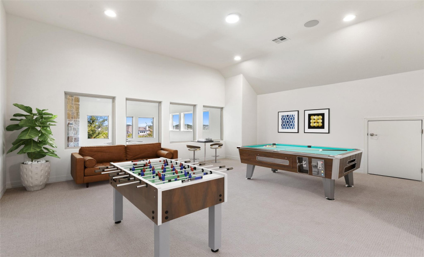 Upstairs game room / playroom with virtually staged furniture for illustration purposes only