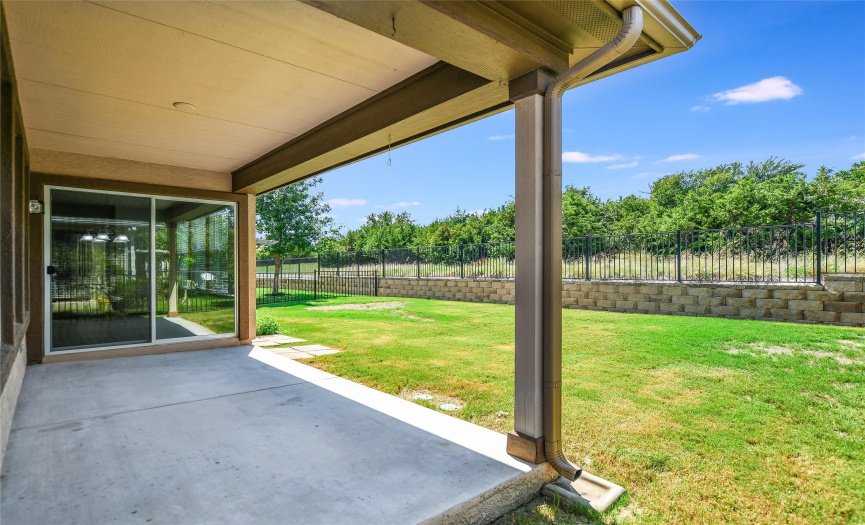 Enjoy the open, hill country view from the covered.