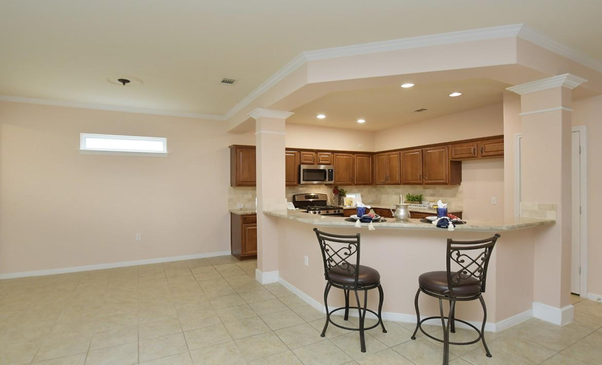 The kitchen is open to the living and dining areas, making it easy for the cook to participate.