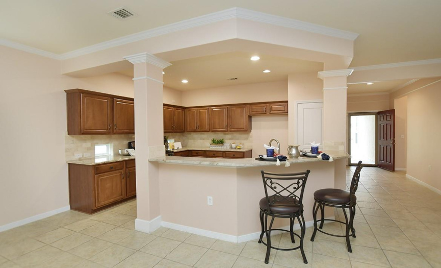 Two bedrooms reside off the generous foyer which leads into the kitchen/living/dining areas.