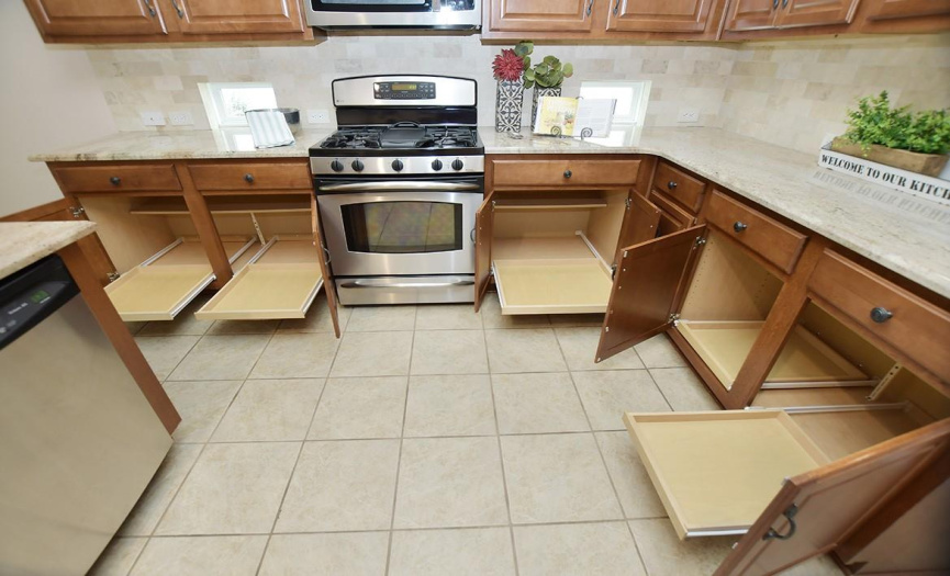 Much appreciated pull-out shelves are found in lower kitchen cabinets.