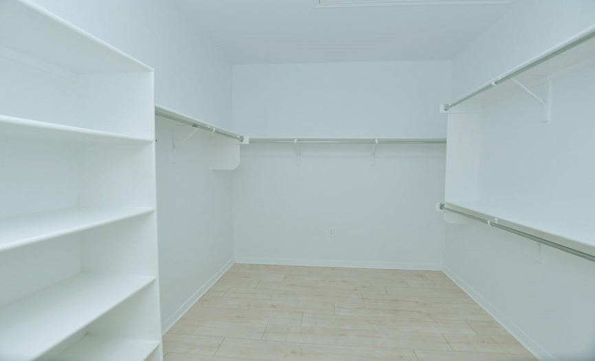 A nicely appointed closet is located in the primary bath.