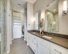 Dual vanity master bathroom and closet. Walk in, glass enclosed shower with separate large tub.