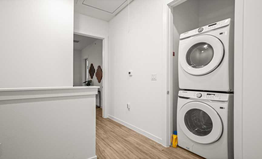 A convenient laundry closet in the upstairs hallway with stackable washer and dryer connections.