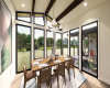 Similar to the main living room, the dining room features large full-height windows in addition to transom windows above, creating a seamless floor-to-ceiling connection with the outdoor areas of the property.