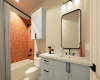 En-suite to the second bedroom, this bathroom features bright and playful wall tile and cabinetry!