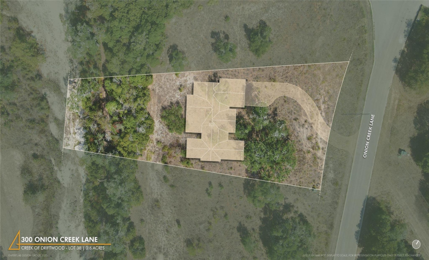 Site plan shows the placement of the home, nestled between a mature Live Oak grove and natural treeline on the property.