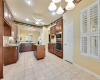 Breakfast area adjoins kitchen with built-in Whirlpool oven and microwave.