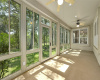 Enclosed back patio. Screened sliding windows can be opened or closed for fresh air or climate control.