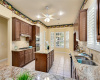 Granite counters and plantation shutters in kitchen and breakfast area.