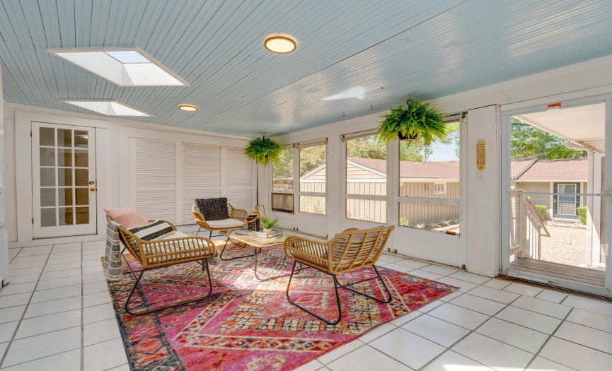Outdoor sun room off kitchen and dining room