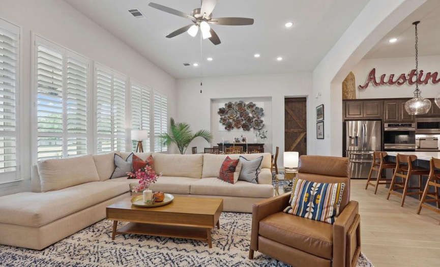 Living room- Plantation shutters throughout this home