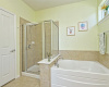 Standup shower and garden tub in main bath.