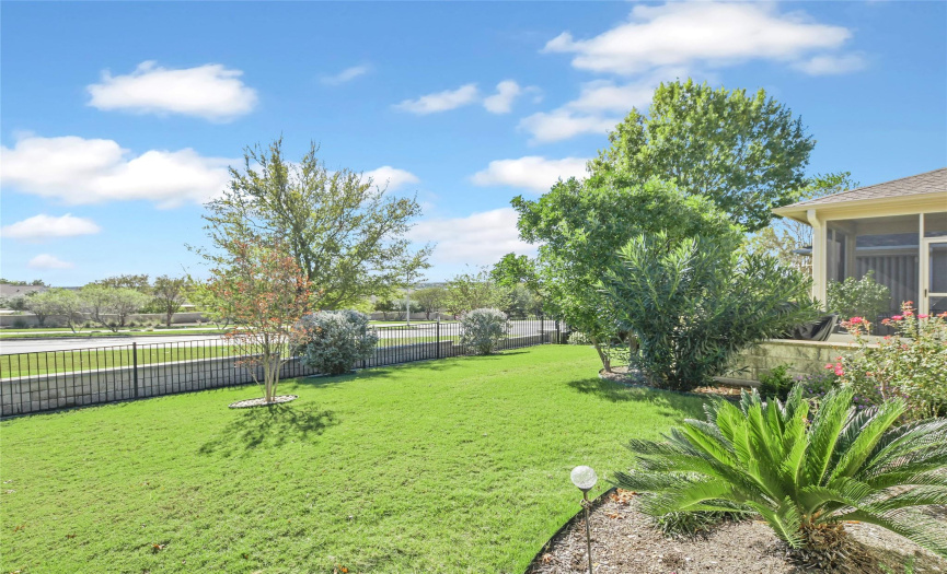 Back of home offers elevated, over rooftop views of Sun City and the Central Texas Hill Country.