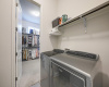 Laundry room conveniently located off the primary closet and the hallway