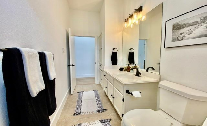 Second full bath with linen closet and tub/shower. Recently painted cabinetry.
