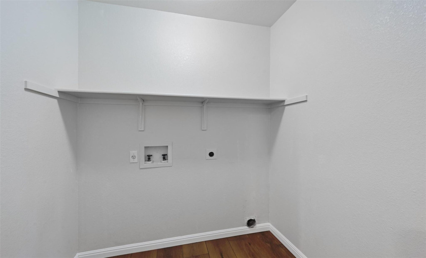 Laundry room with built-in shelving