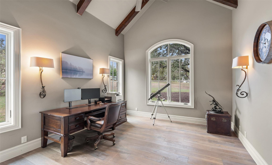 The main floor also includes a generous sized office with an oversized window overlooking the grove of oak trees in the front of the home.