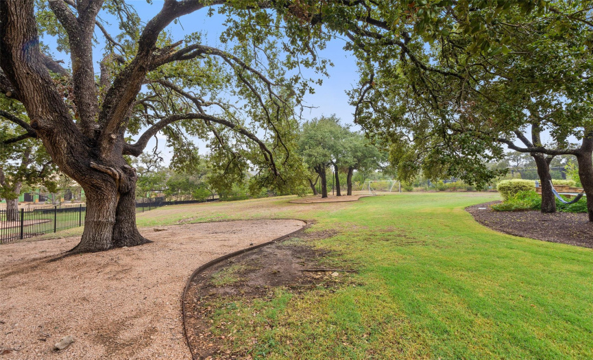 Oversized oak trees are scattered all around property. 
