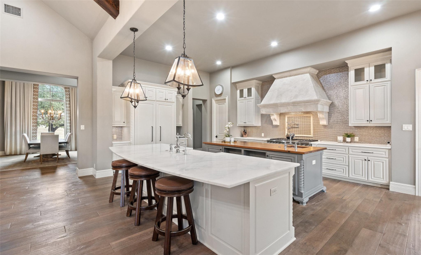 The kitchen exudes timeless elevated elegance without forgoing the welcome comfort of a home.